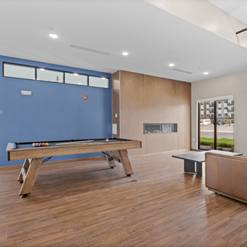 a game room with a pool table and a blue wall at Yellowstone Landing, Montana